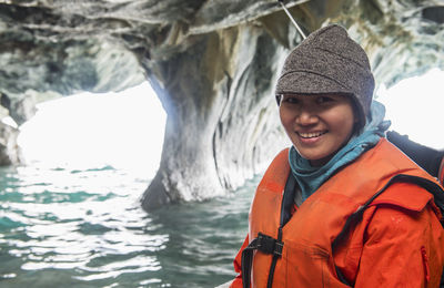 Woman admiring the marble caves, catedral de marmol, chile