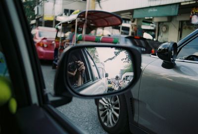 Reflection of car on side-view mirror