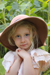 Portrait of young woman wearing hat