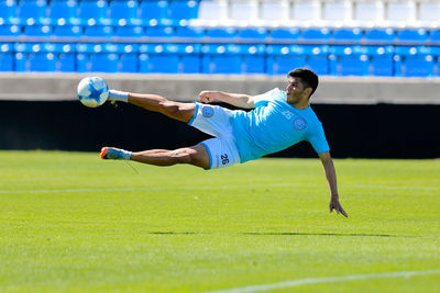 Man playing soccer on field