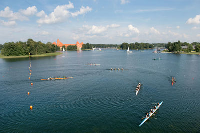 High angle view of people in sea against sky