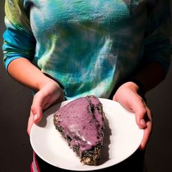 Midsection of woman holding ice cream