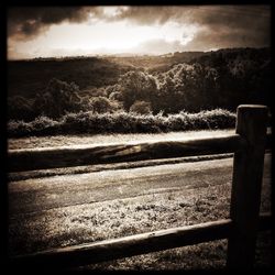 Scenic view of landscape against cloudy sky