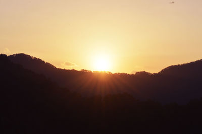 Silhouette of mountain at sunset