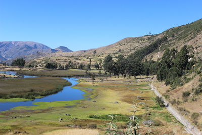 Scenic view of lake and mountains inthe  intihuatana archaeological complex in ayacucho, peru