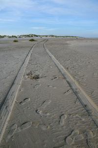Surface level of tire tracks on sand