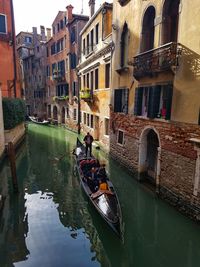 Canal amidst buildings in city