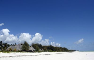 Scenic view of landscape against blue sky