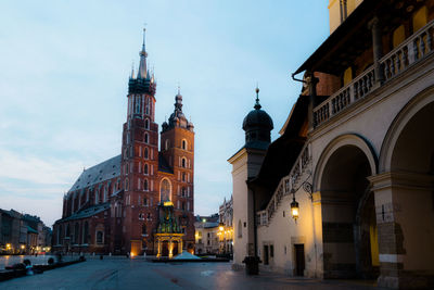 View of buildings in city at dusk