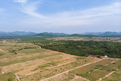 Scenic view of agricultural field against sky