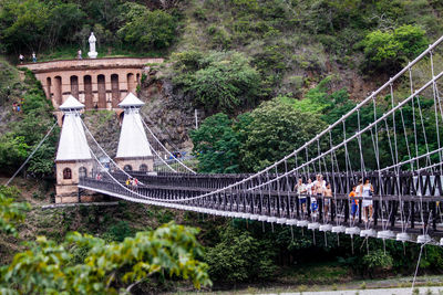 People walking on footbridge