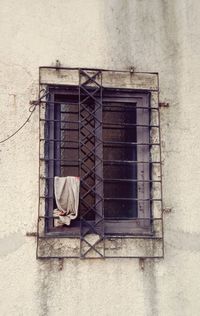 Low angle view of window on wall of building