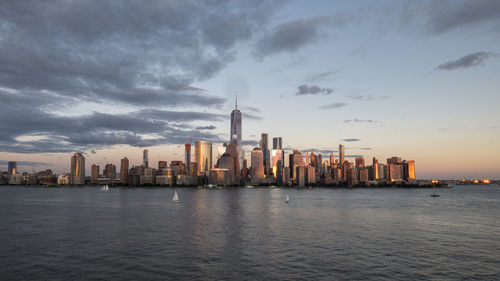 Modern buildings in city at sunset