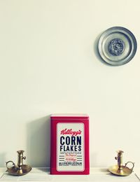 Information sign on table against wall at home