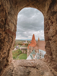 Buildings seen through arch window