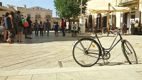 Bicycle parked in front of building