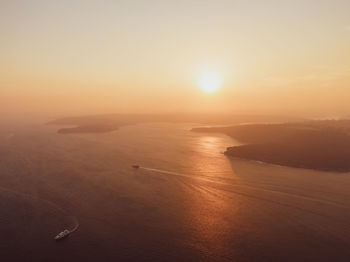 Drone sunset view of sydney harbour, australia. the air is full of haze and smoke from bushfires