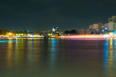 Illuminated city at waterfront