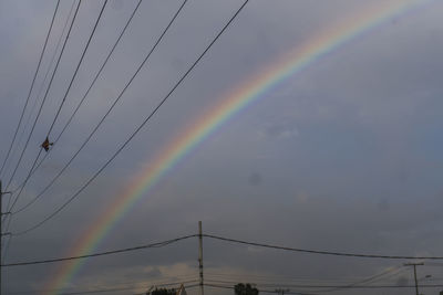 Low angle view of rainbow against sky