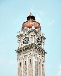 Low angle view of clock tower against sky