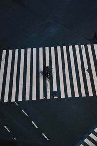 High angle view of person crossing road