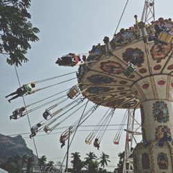 Low angle view of ferris wheel against sky