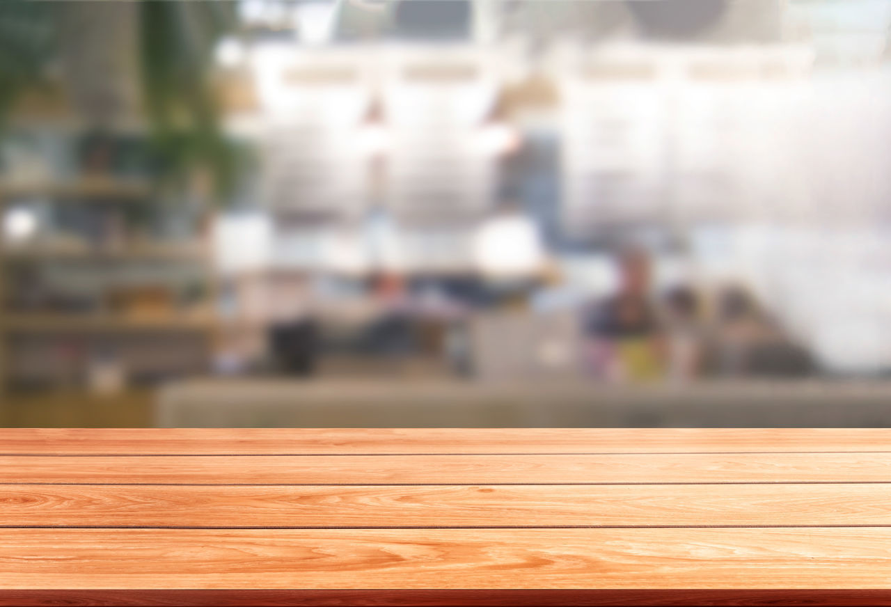 CLOSE-UP OF WOOD AGAINST BLURRED BACKGROUND