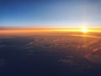 Aerial view of cityscape against sky during sunset