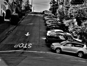 Cars on road against buildings in city