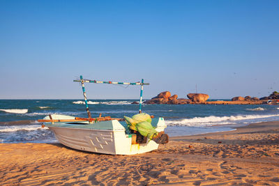 Scenic view of beach against clear sky