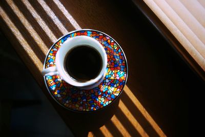 Close-up of fresh turkish coffee in pot on window sill