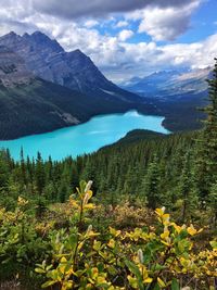 Scenic view of lake and mountains against sky