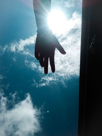 Low angle view of silhouette person swimming in sea