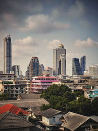 Modern buildings in city against sky