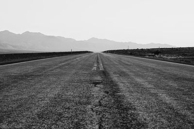 Scenic view of road passing through desert