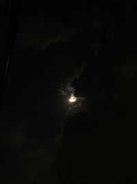 Low angle view of moon in sky at night