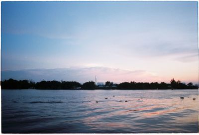 Scenic view of sea against sky at sunset