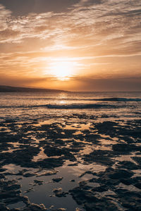 Scenic view of sea against sky during sunset