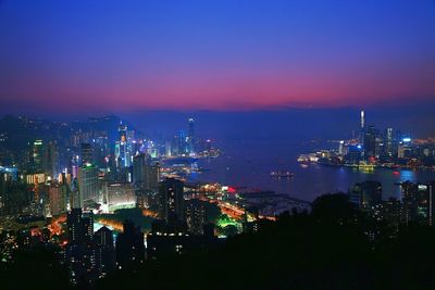 Aerial view of city lit up at night