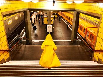 People at illuminated subway station