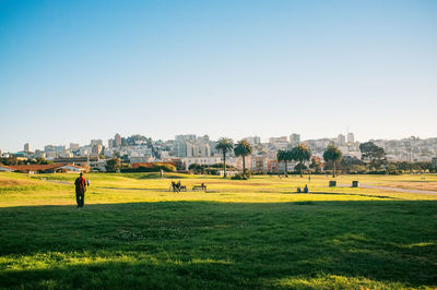 Built structure on grassy field against clear sky