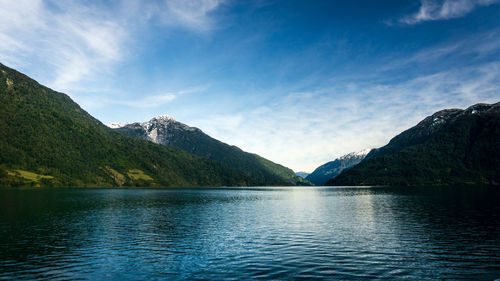 Scenic view of lake by mountains against sky- todos los santos lake, chile 