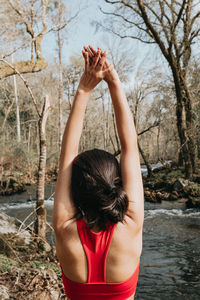 Rear view of woman standing in water