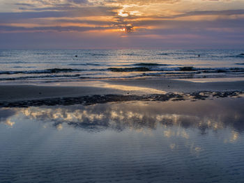 Scenic view of sea against sky at sunset