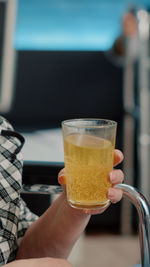 Midsection of woman holding drink