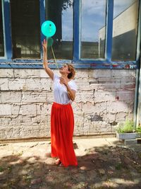 Woman playing with balloon