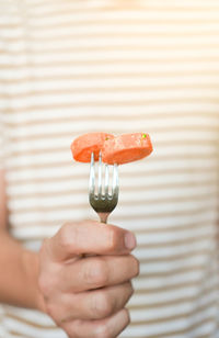 Close-up of hand holding ice cream