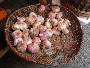 High angle view of garlic in wicker basket
