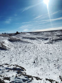 Scenic view of snow covered mountain against sky