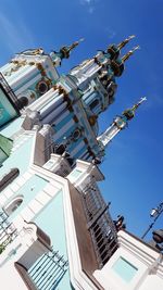 Low angle view of buildings against blue sky